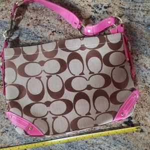 Coach purse with pink trim